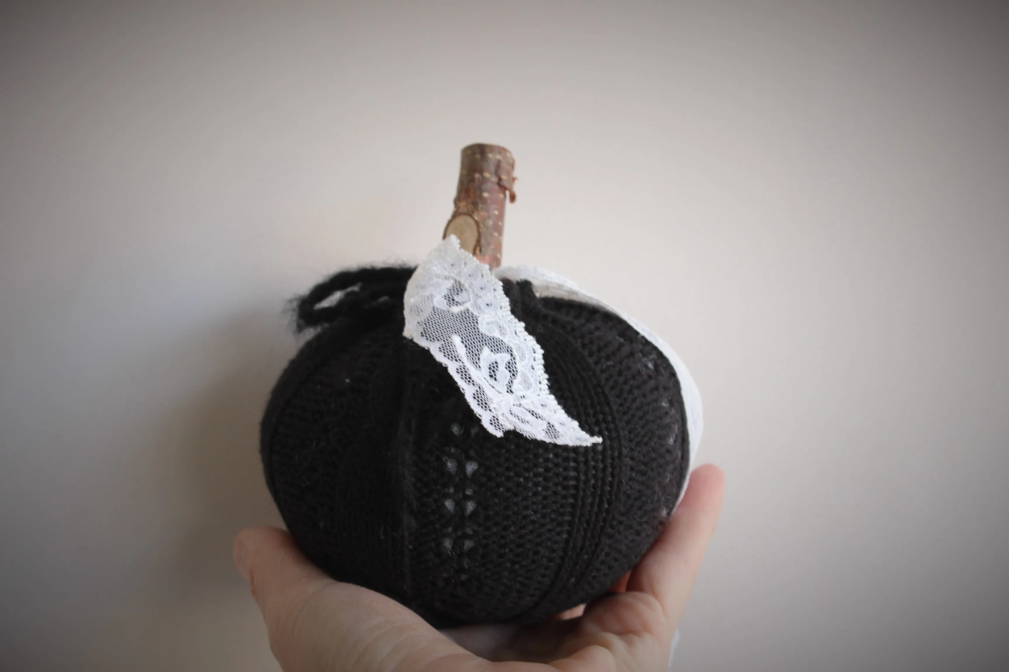 Knit Mini Pumpkin Pillow Pouf in Black with Ivory Lace and Wooden Stem