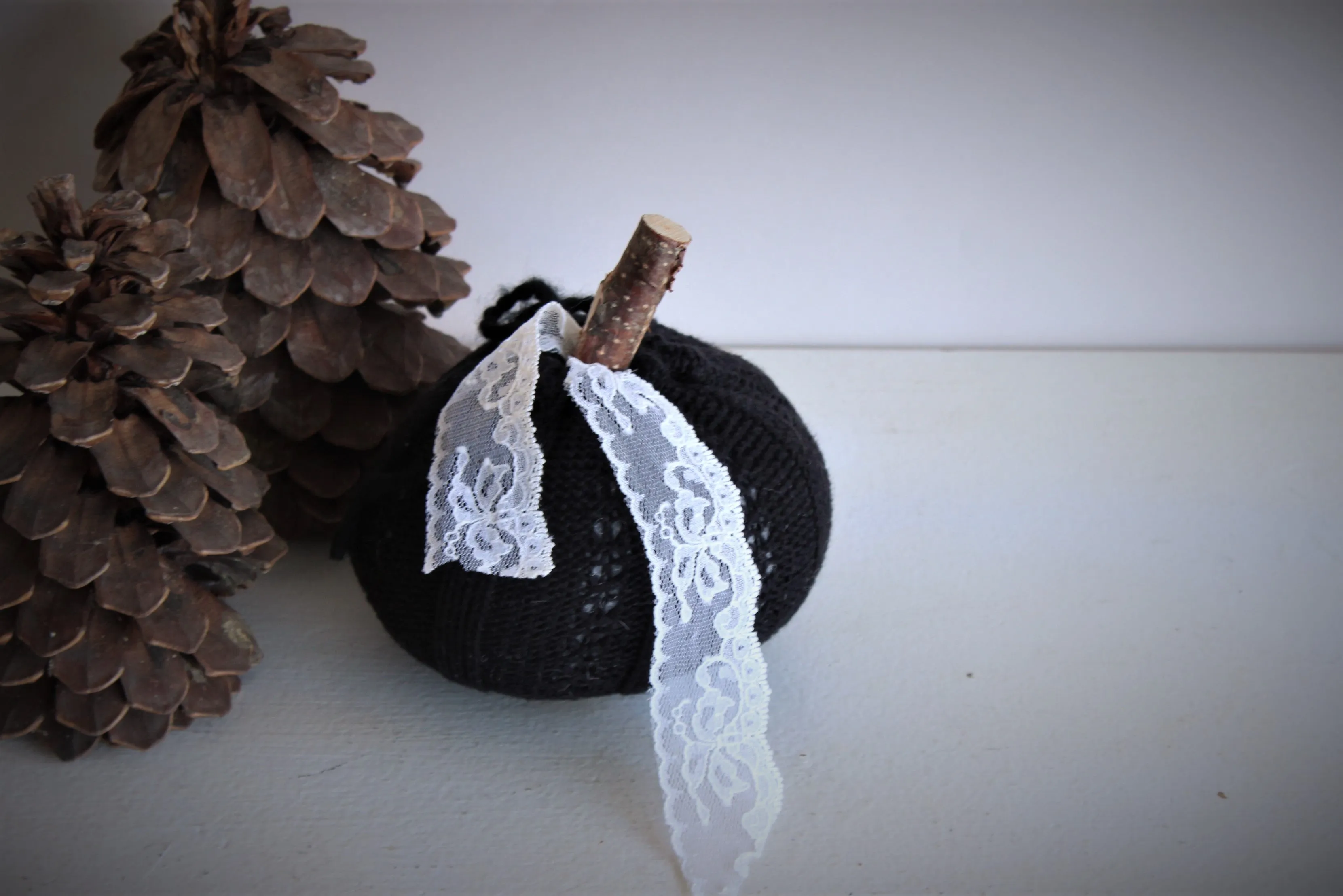 Knit Mini Pumpkin Pillow Pouf in Black with Ivory Lace and Wooden Stem
