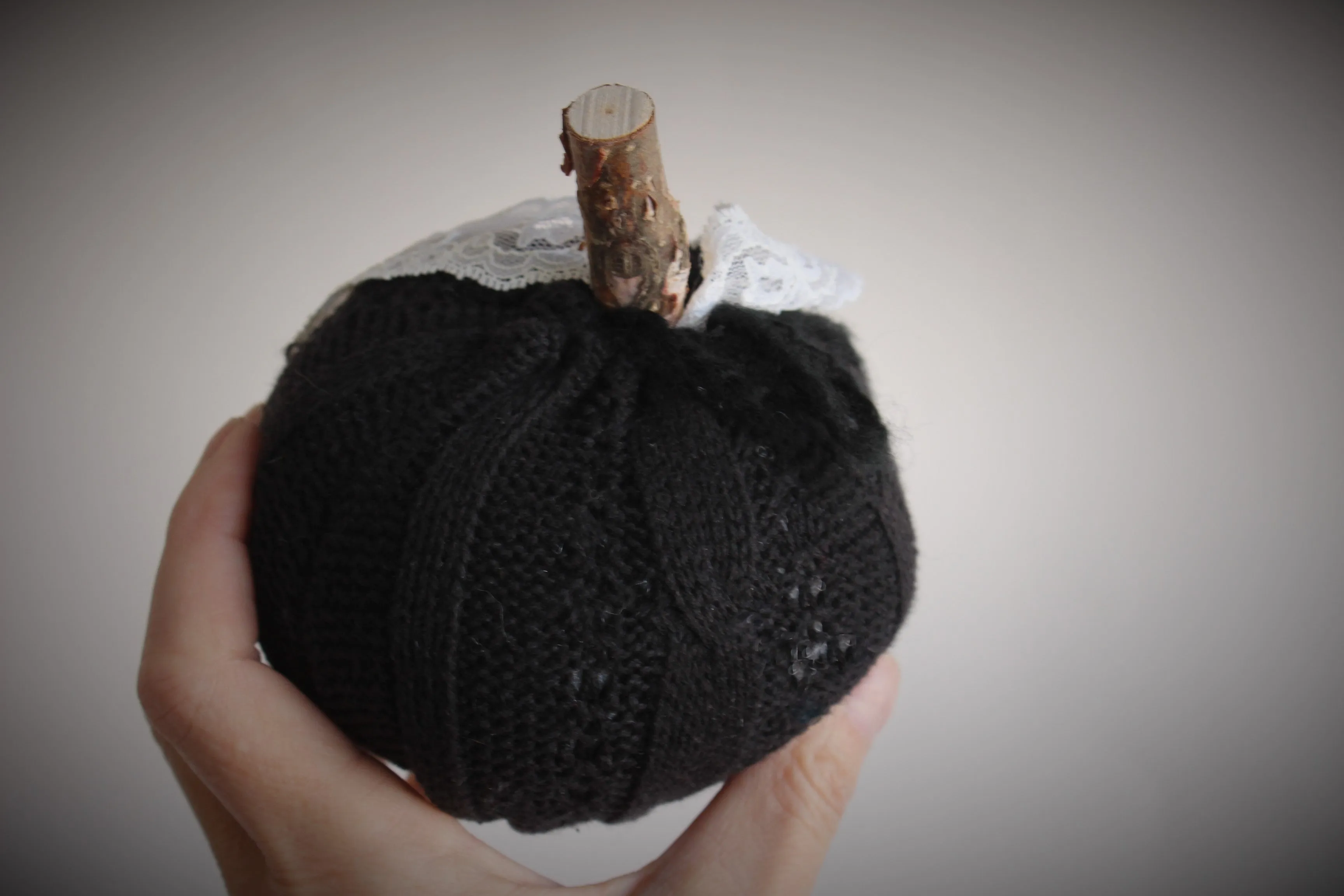 Knit Mini Pumpkin Pillow Pouf in Black with Ivory Lace and Wooden Stem