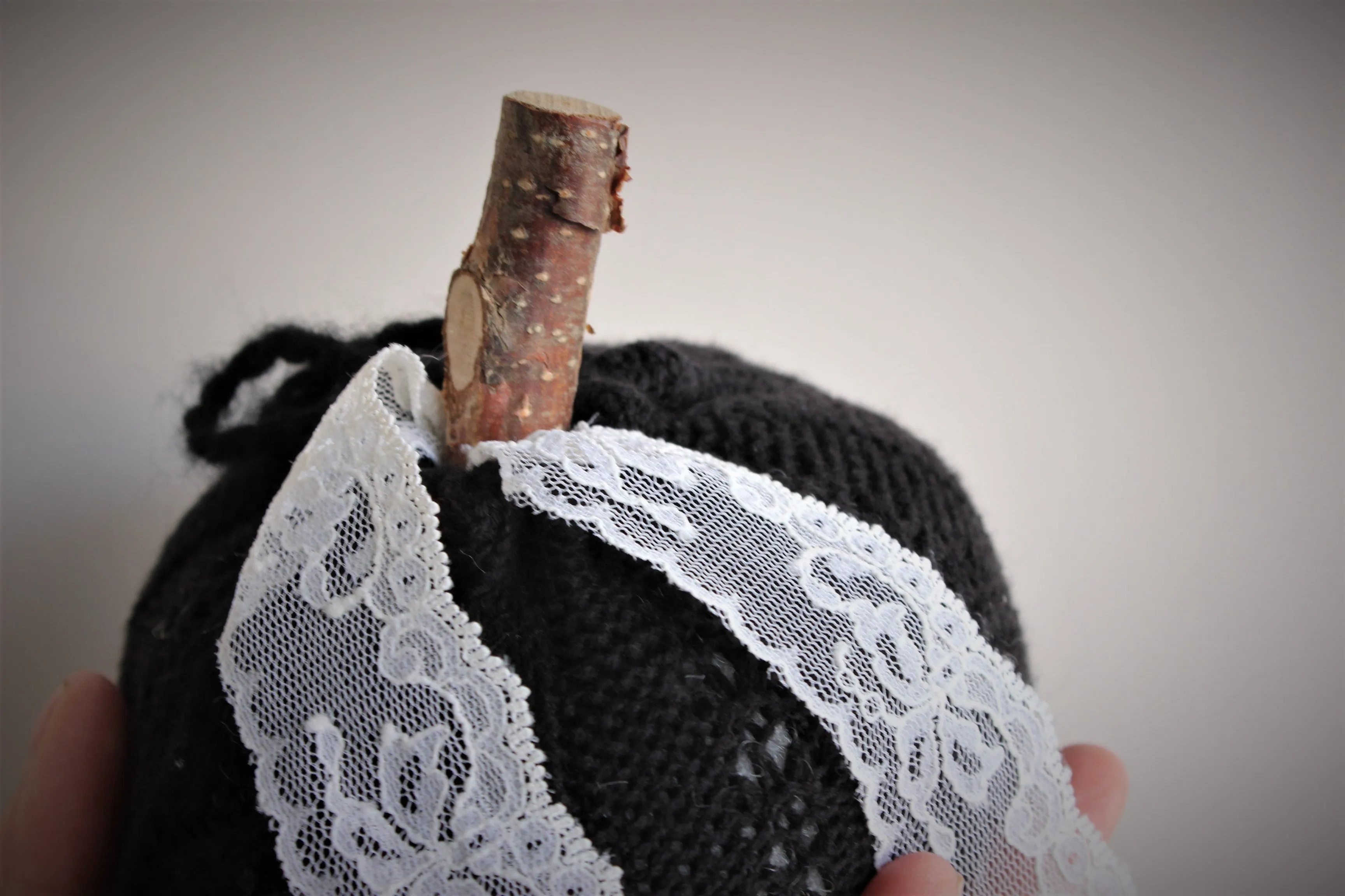 Knit Mini Pumpkin Pillow Pouf in Black with Ivory Lace and Wooden Stem