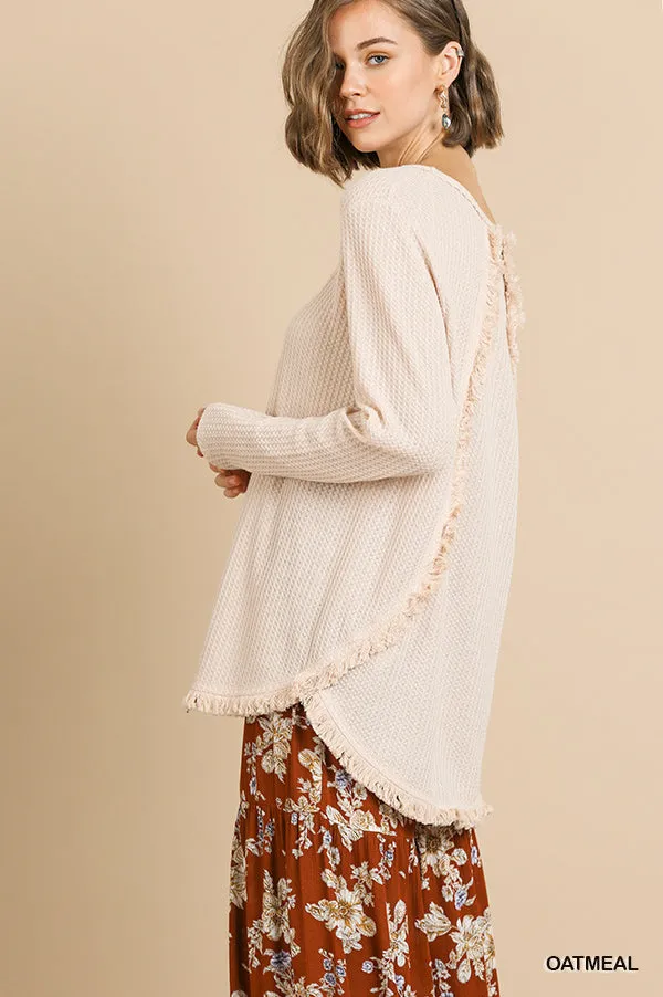 Long Sleeve Waffle Knit Round Neck Top with High Low Frayed Scoop Hem and Frayed Back Detail